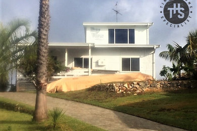 Photo of a beach style home design in Perth.