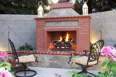Inspiration for a mid-sized arts and crafts backyard patio in Other with an outdoor kitchen, concrete slab and no cover.