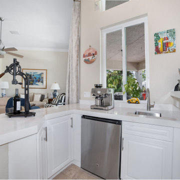 Updated Wet Bar with Stainless Steel Appliances and White Quartz in Davie