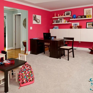 This is an example of a medium sized modern craft room in DC Metro with red walls, carpet and a freestanding desk.