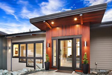 Large trendy multicolored two-story mixed siding house exterior photo in Seattle with a metal roof