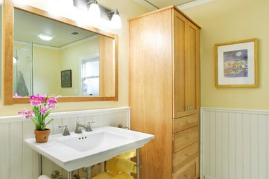 Inspiration for a mid-sized country master bathroom in Sacramento with furniture-like cabinets, light wood cabinets, white tile, yellow walls, ceramic floors, a pedestal sink, a corner shower, a two-piece toilet, subway tile and solid surface benchtops.