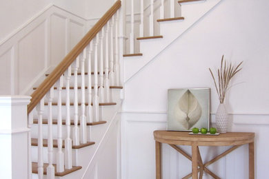 Inspiration for a mid-sized contemporary light wood floor foyer remodel in New York with white walls
