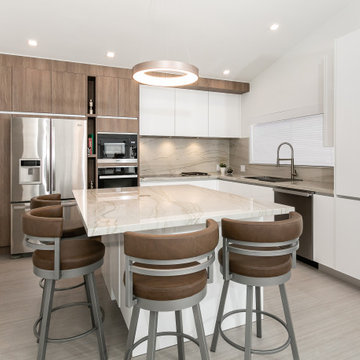 Spacious Kitchen Layout with Modern Fixtures and Cabinetry in South Florida