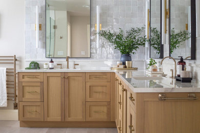 Large transitional master gray tile and terra-cotta tile porcelain tile, gray floor and double-sink bathroom photo in Seattle with shaker cabinets, light wood cabinets, a one-piece toilet, white walls, an undermount sink, quartz countertops, a hinged shower door, white countertops and a built-in vanity