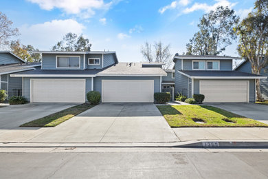 Example of a small blue two-story townhouse exterior design in Los Angeles