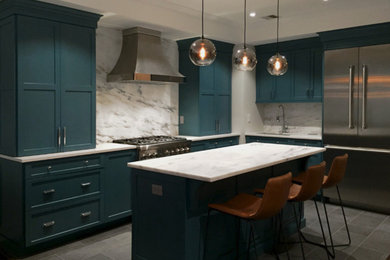 Photo of a mid-sized contemporary l-shaped eat-in kitchen in New York with an undermount sink, shaker cabinets, turquoise cabinets, marble benchtops, yellow splashback, stone slab splashback, stainless steel appliances, slate floors, with island, grey floor and yellow benchtop.