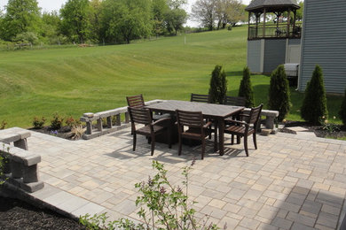 Patio container garden - large traditional backyard concrete paver patio container garden idea in New York with no cover
