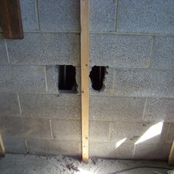 Foundation repair, retrofit by placing rebar and concrete in cores of block - Products