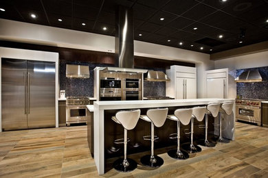 Mid-sized light wood floor kitchen photo in Minneapolis with stainless steel appliances