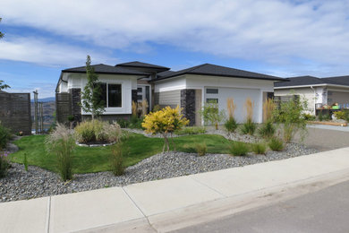 Example of a minimalist white mixed siding house exterior design in Other