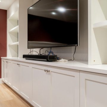 Custom Built-in Media Wall with Integrated Storage and Cabinetry