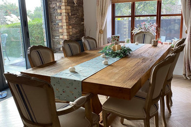 Elm pedestal table with american oak Beaumont chairs and armchairs