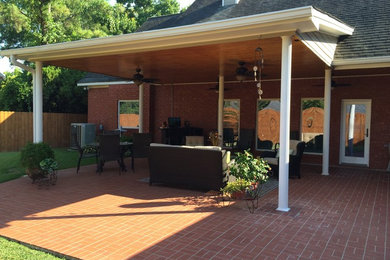 Example of a large classic patio design in New Orleans