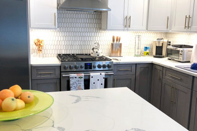 Eat-in kitchen - mid-sized modern l-shaped dark wood floor and brown floor eat-in kitchen idea in New York with an undermount sink, shaker cabinets, gray cabinets, quartz countertops, white backsplash, ceramic backsplash, stainless steel appliances, an island and white countertops