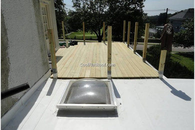 Photo of a medium sized mediterranean roof terrace in Boston with a roof extension.