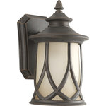 Progress Lighting - 1-Light 6.5" Wall Lantern, Aged Copper - Tudor styling meets prairie design. Gradual umber tint on glass shades. A woven cast pattern encases a casual profile. Large scale cast aluminum lantern feature a durable powder coat finish. One-light small wall lantern
