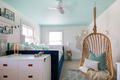 Example of a beach style bedroom design in Denver