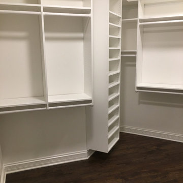Master closet in white with 96" top shelf