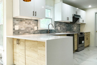 Inspiration for a mid-sized modern single-wall porcelain tile and white floor kitchen remodel in DC Metro with white cabinets, blue backsplash, porcelain backsplash, black appliances and a peninsula