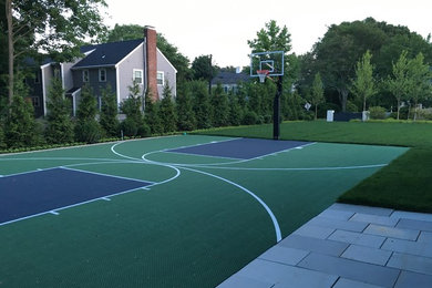 Design ideas for a large traditional backyard outdoor basketball/tennis/multi-game court in Boston.
