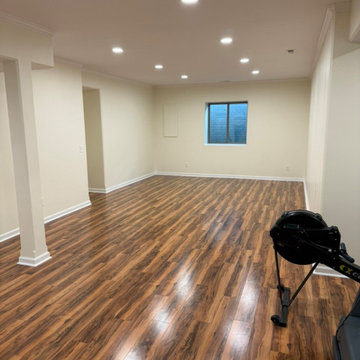 750 Sq Ft Elkhorn Basement Finish with Custom Built-In Office, Flex Space & Red