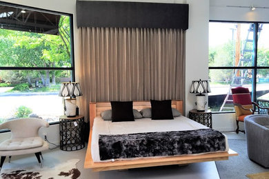 Example of a small trendy master gray floor bedroom design in Albuquerque with white walls and no fireplace