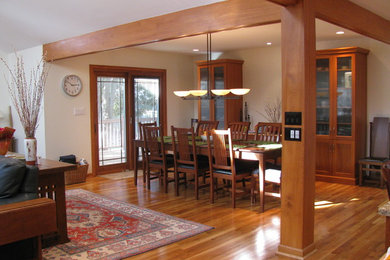 Mid-sized trendy medium tone wood floor and brown floor great room photo in Detroit with beige walls