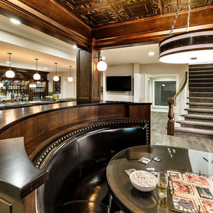 Photo of a large traditional basement in Chicago with beige walls, ceramic flooring and brown floors.