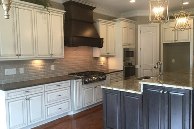 This is an example of a transitional kitchen in Raleigh.