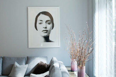 Example of a large trendy loft-style marble floor living room design in New York with white walls, no fireplace and no tv