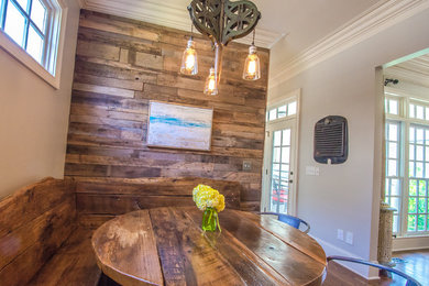 Example of a mountain style medium tone wood floor kitchen/dining room combo design in Nashville with gray walls