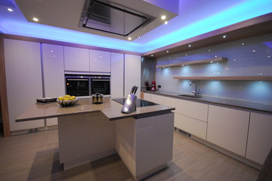 Photo of a contemporary open plan kitchen in Other with a built-in sink, flat-panel cabinets, yellow cabinets, quartz worktops, integrated appliances and an island.