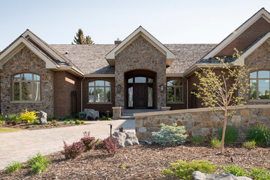 Large transitional red one-story brick gable roof idea in Edmonton