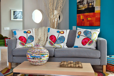 Example of a trendy light wood floor family room design in Austin with multicolored walls