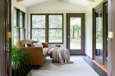 Inspiration for a mid-sized transitional vinyl floor and black floor sunroom remodel in Other