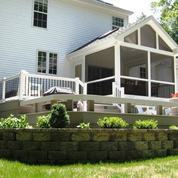 Screened in sunroom with two tier wrap around AZEK deck