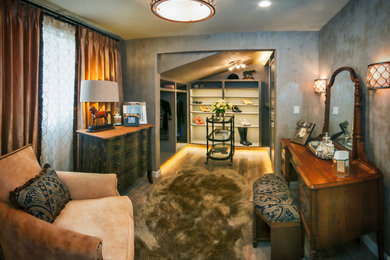 Inspiration for a large transitional gender-neutral dark wood floor and brown floor dressing room remodel in San Diego with open cabinets and white cabinets