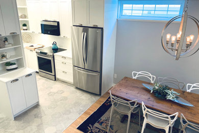 Example of a minimalist dining room design in Vancouver