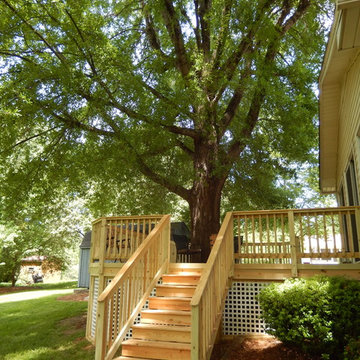 Custom Pressure Treated Wood Deck with Square White Vinyl Lattice