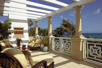 Beach style backyard patio photo in Miami with a pergola