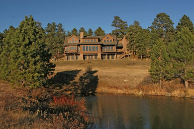 Large rustic exterior home idea in Denver