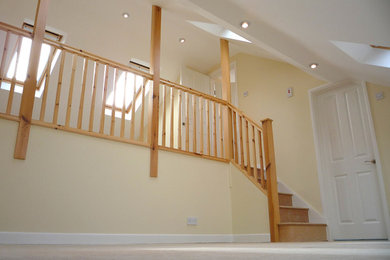 Photo of a small modern wood curved staircase.
