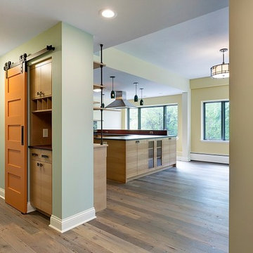 Antique Skip Oak Planed Smooth Flooring in an Eclectic Hallway and Kitchen
