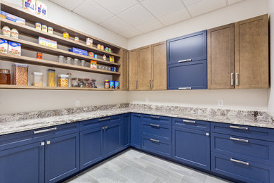 Kitchen pantry - mid-sized modern l-shaped porcelain tile and gray floor kitchen pantry idea in Other with shaker cabinets, blue cabinets, granite countertops and no island
