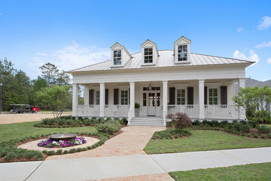 Design ideas for a large transitional two-storey white exterior in New Orleans with wood siding.