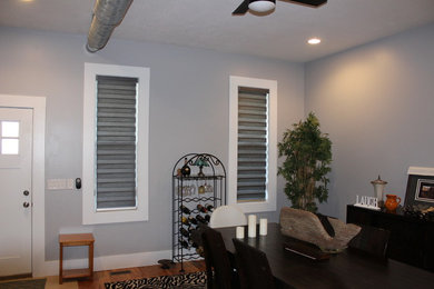 Inspiration for a mid-sized transitional light wood floor enclosed dining room remodel in Indianapolis with gray walls and no fireplace