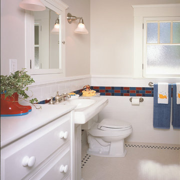Children's bathroom with tile and built in cabinetry