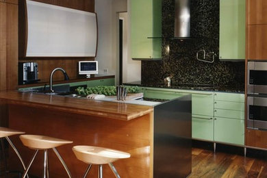 Open concept kitchen - small contemporary u-shaped medium tone wood floor and brown floor open concept kitchen idea in Other with an undermount sink, flat-panel cabinets, medium tone wood cabinets, wood countertops, multicolored backsplash, mosaic tile backsplash, stainless steel appliances and a peninsula