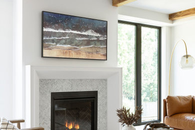 Example of a minimalist living room design in Toronto with white walls, a hanging fireplace and a tile fireplace